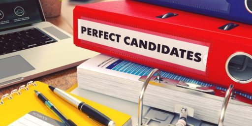 Perfect Candidates - Red Office Folder on Background of Working Table with Stationery, Laptop and Reports. Business Concept on Blurred Background. Toned Image.