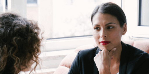 Workplace leader listening attentively to employee during a misconduct report conversation.